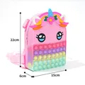 Pink silicone unicorn pop-it backpack for kids with clear 22x15x6cm dimension labels - Unicorn Flower
