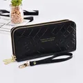 Elegant black women's long wallet with double zipper, floral quilted pattern and wrist strap - Long Style (FC181207) / Black