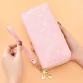 Elegant pink long wallet featuring star embossing, double zipper, and wristlet strap - Four-pointed Star Embossed Double Zip (FC Four-pointed Star Double Zip) / Pink Glossy