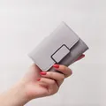 Elegant small mauve trifold wallet for women featuring a stylish metal buckle closure - Cube Style / Gray