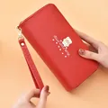 Stylish red long wallet for women featuring a cute bear icon and wristlet strap. - Red Cartoon Bear Style / Red
