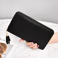 Elegant black woven long wallet for women with golden zipper and stylish leather tassel - Black