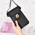 Elegant minimalist black vertical crossbody cell phone bag with golden metal lock - Black