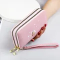 Pink long wallet for women with double zipper heart print and wrist strap elegant style - Pink
