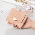 Elegant pink short wallet for women with leaf embossing and a gold leaf metal clasp. - Pink