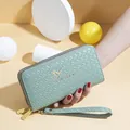 Stylish mint green woven long wallet for women with double zipper and swallow logo. - Green