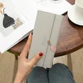 Light grey long tri-fold women's wallet featuring a cute pink leaf pendant detail - Light Gray