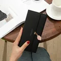 Elegant black long tri-fold wallet for women featuring a delicate leaf pendant charm - Black