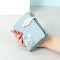 Light blue women's short soft leather wallet with daisy print and leaf strap detail - Blue