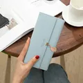 Elegant light blue trifold women's long wallet featuring a cute leaf pendant. - Light Blue
