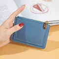 Blue faux leather zippered card holder with multi-slot design and coin pouch for daily use. - Blue