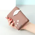 Brown faux leather bifold wallet for women with daisy print and leaf-shaped strap - Coffee