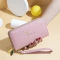 Portefeuille long rose pour femme aspect tressé avec double zip et logo oiseau doré - Rose