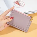 Mauve faux leather zip coin purse with multiple card slots and gold hardware. - Light Purple