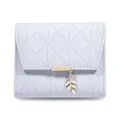 Detailed close-up view of light purple quilted tri-fold wallet with gold leaf pendant - Purple