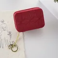 Small red quilted cosmetic pouch with gold keychain and lobster clasp for lipstick storage - Red