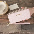Long pink double-zipper wallet featuring geometric cube pattern and wrist strap - Pink