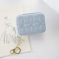 Elegant light blue quilted embroidery mini cosmetic pouch with gold keychain for women - Blue