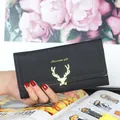 Portafoglio lungo nero da donna elegante con chiusura a testa di cervo dorata. - Nero