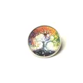 Macro detail of a vintage Tree of Life glass cabochon brooch with colorful artistic pattern - Life Tree