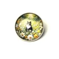 Detailed macro view of a circular tuxedo cat brooch with a floral garden glass dome. - Cow Cat In Flowers Style