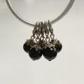 Close-up detail of five black pearl charms featuring silver lobster clasps and ornate caps - Lobster Clasp Flower Cap Pearl Pendant / Black