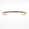 Close-up of engraved inspirational quote on rose gold stainless steel cuff bracelet - Beautiful Girl Inspirational Quote / Rose Gold