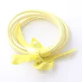 Elegante set di tre braccialetti jelly in silicone dorato con un grazioso fiocco di nastro - Giallo chiaro