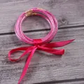 Stylish pink glitter silicone bracelet set with a decorative fuchsia satin ribbon bow - 5 Pieces / Rose Red