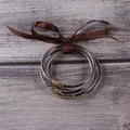 Elegant multi-layer glitter silicone bangle bracelets set with a brown satin ribbon bow. - 5 Pieces / Coffee