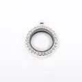 Detailed macro view of a silver round alloy locket pendant with sparkling clear rhinestones. - White K/Silver