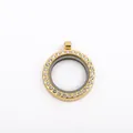 Close-up of a circular gold locket pendant with sparkling rhinestone bezel - Gold