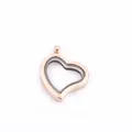 Detailed close-up view of a rose gold heart-shaped floating locket with clear glass windows - Rose Gold