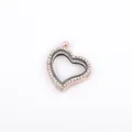 Detailed close-up of a rose gold heart-shaped floating locket with rhinestones - Gold