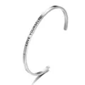 Detail shot of silver stainless steel cuff bracelet engraved with LOVE YOURSELF - Love Yourself