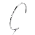 Detailed view of stainless steel cuff bracelet with 'YOU ARE MY PERSON' engraving - You are my person