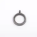 Detail view of a circular gunmetal floating locket pendant with rhinestone edge - Black