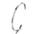 Close-up detail of stainless steel cuff bracelet with keep fucking going engraving - KEEP FUCKING GOING