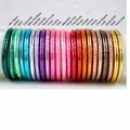 Detailed view of various colorful glitter silicone bangles with embossed lotus patterns - Multicolor