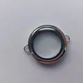 Close-up view of a circular transparent silver glass locket pendant for jewelry making - Transverse Ring (Medium) / 6x30mm / Steel