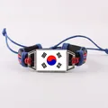 Dettaglio del bracciale in pelle intrecciata con bandiera della Corea del Sud regolabile - Stile Pelle Rettangolare