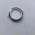 Macro view of a circular transparent locket frame with dual side attachment loops - Transverse Ring (Large) / 7x35mm / Steel