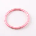 Macro view of matte pink silicone bracelet with smooth finish and simple design - Pink