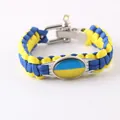 Detailed view of the blue and yellow Ukraine flag paracord survival bracelet. - Ukraine Flag Style / Alloy U-Shackle