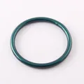 Close-up top view of a stylish matte metallic teal green silicone fashion bracelet ring. - Dark Green