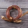 Detail view of seven layer silicone bangles with sparkling rose gold glitter and ribbon - Rose Gold