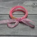 Juego de 5 pulseras de silicona con purpurina rosa vibrante y un lazo decorativo - Rosa rojo