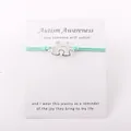 Detail van zilveren puzzelarmband voor autismebewustzijn met waskoord en cadeaubon - Zeegroen
