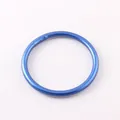 Close-up view of a matte blue silicone ring bracelet showing its smooth circular finish. - Blue