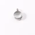 Detail view of a circular stainless steel locket pendant with a clear transparent window - ID 10mm OD 15mm / Steel